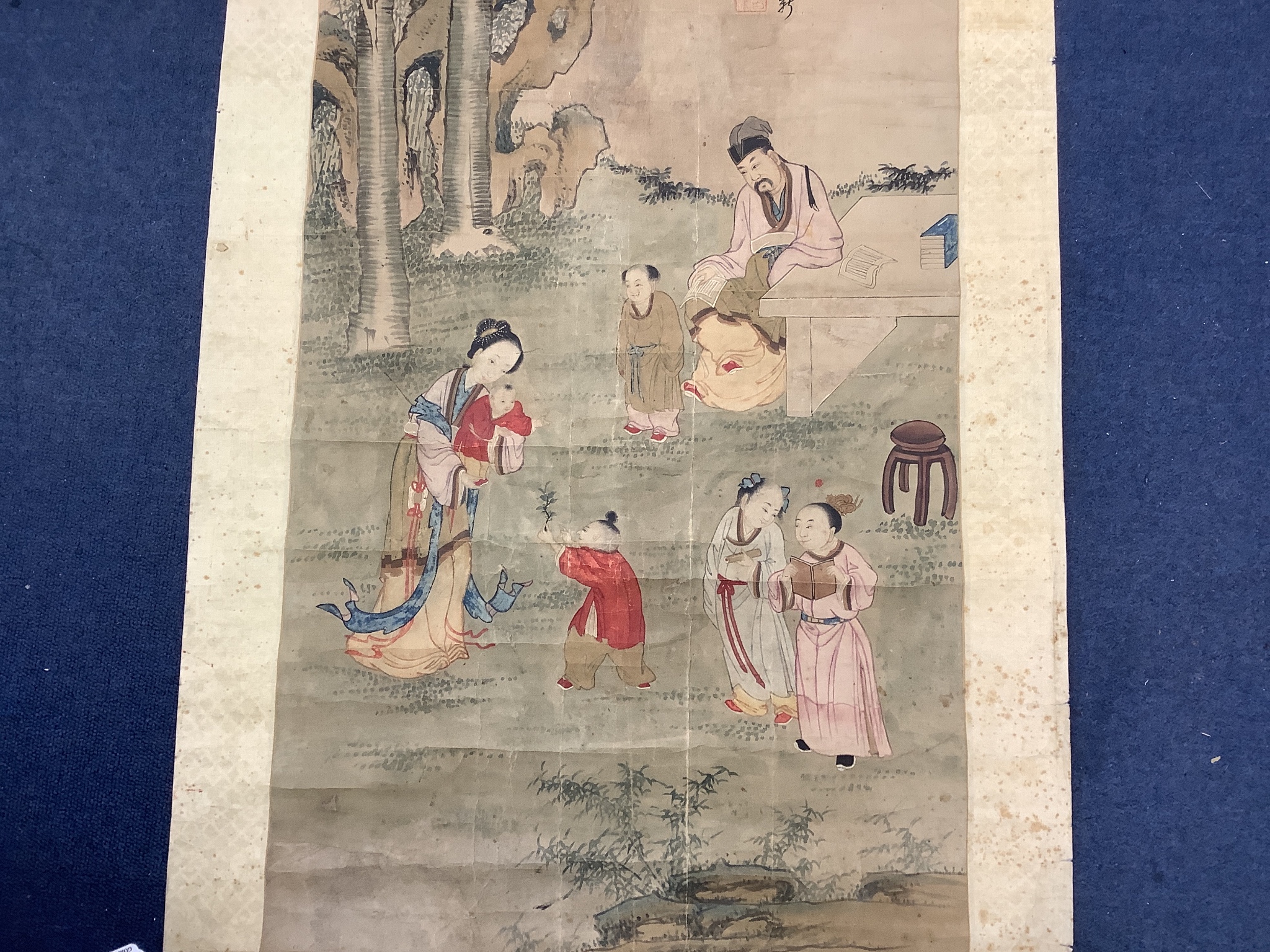 A 19th century Chinese ancestor painting, a 19th century Chinese scroll painting on paper of a sage and other figures, Image 100x 47 cm and a calligraphic scroll (3)